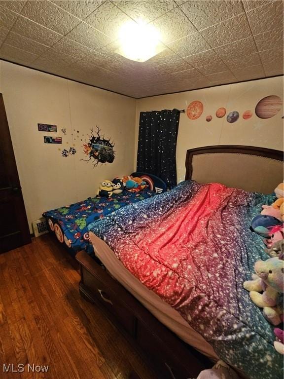 bedroom featuring hardwood / wood-style flooring