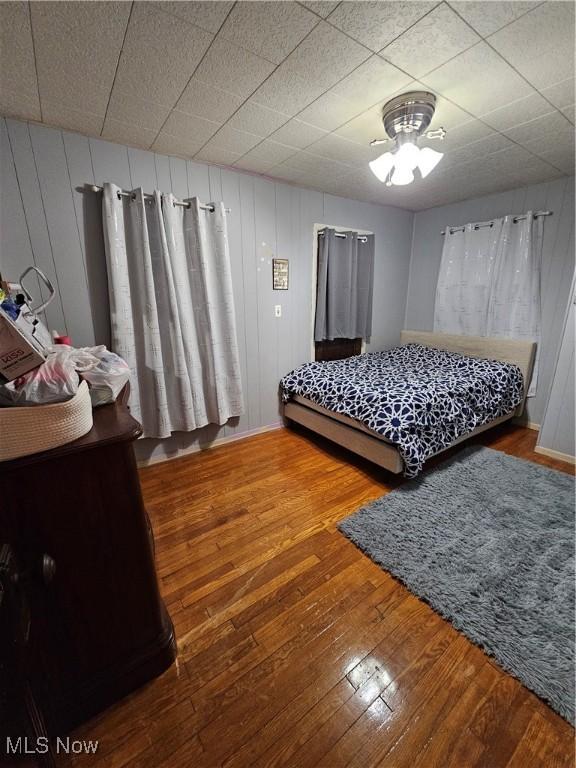 bedroom with wood-type flooring