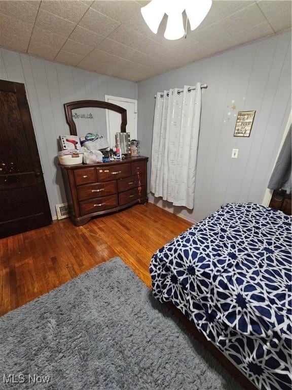 bedroom with hardwood / wood-style floors