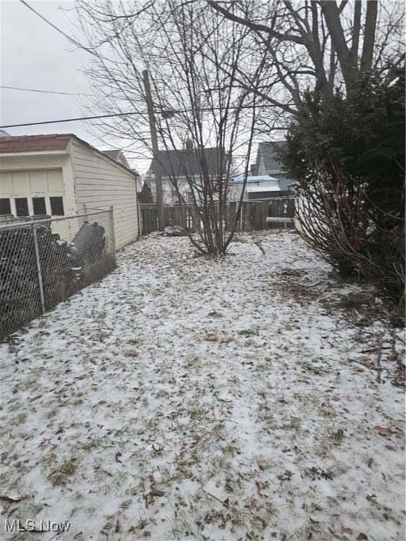 view of yard covered in snow