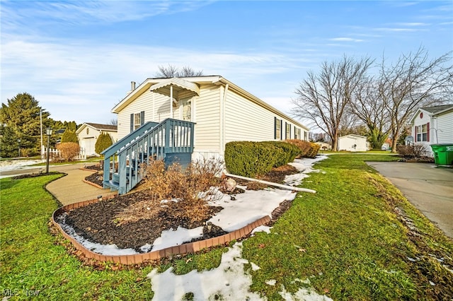 view of home's exterior with a lawn