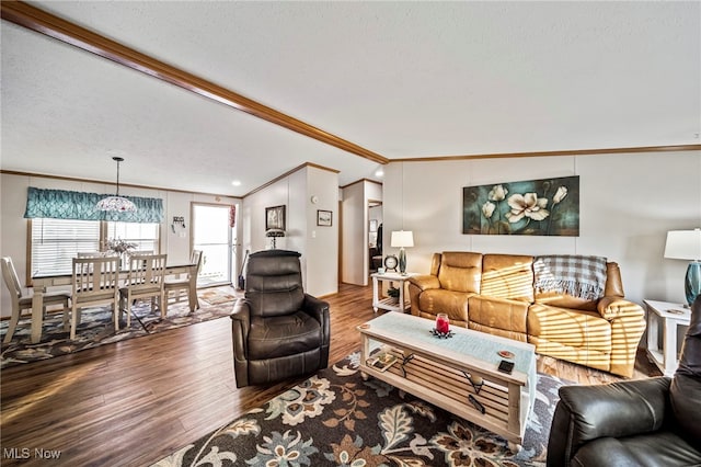 living room featuring ornamental molding, hardwood / wood-style floors, and a textured ceiling