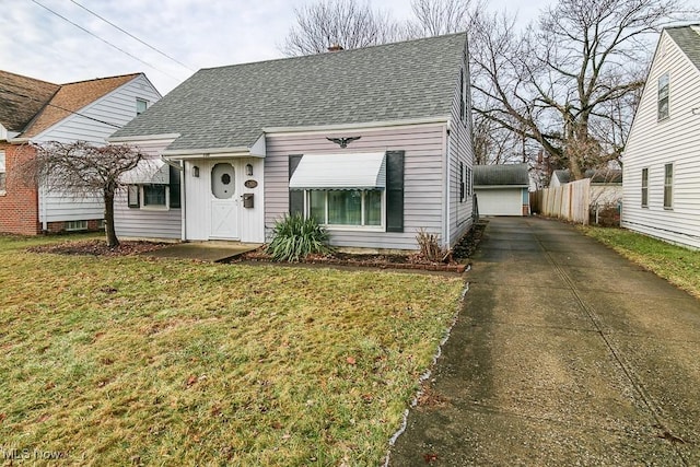 view of front facade with a garage and a front lawn