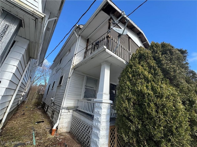 view of property exterior with a balcony