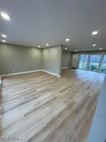 unfurnished living room with light hardwood / wood-style floors