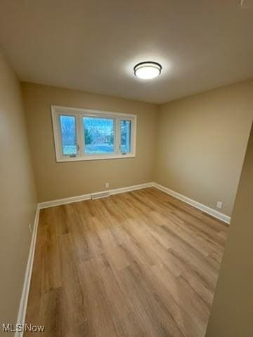 unfurnished room featuring light hardwood / wood-style flooring