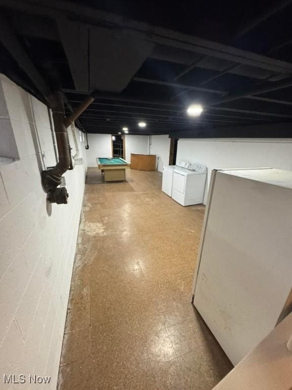 basement with billiards and washing machine and dryer