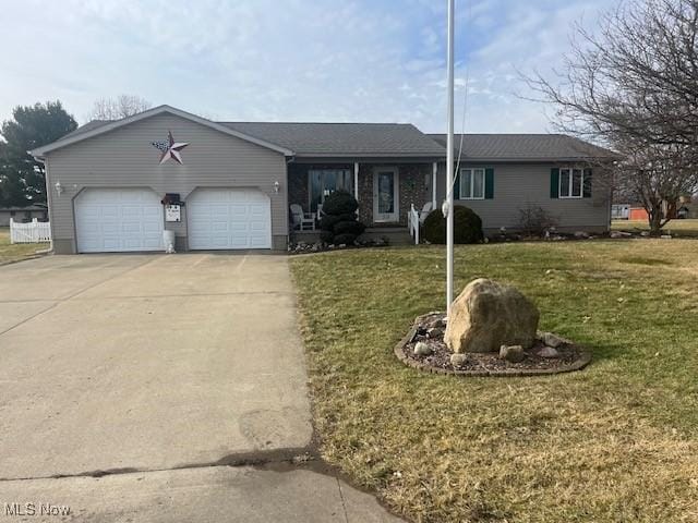 single story home with a garage and a front yard