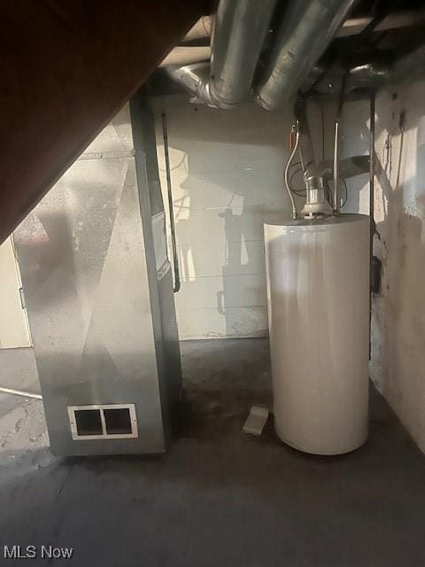 utility room featuring water heater