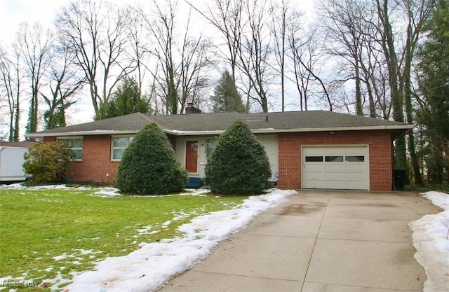 single story home with a garage and a front lawn