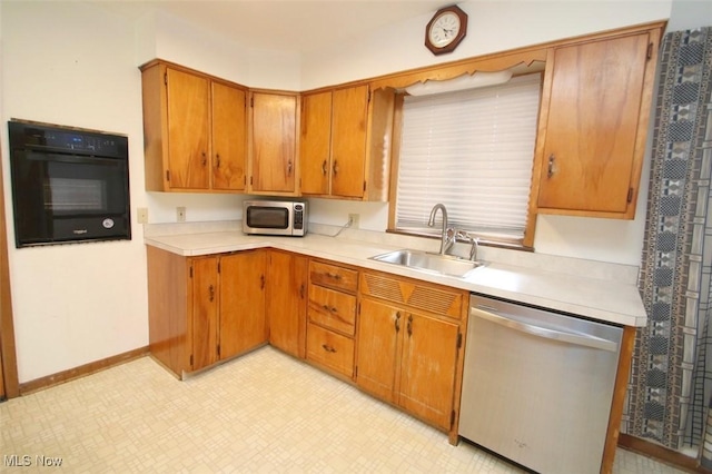 kitchen featuring stainless steel appliances and sink