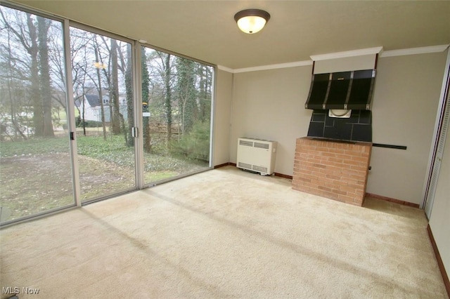 unfurnished sunroom featuring heating unit