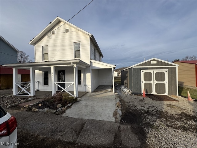 view of front of property featuring a storage shed