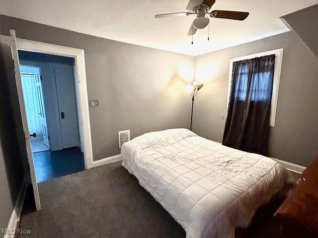 bedroom featuring carpet flooring, ceiling fan, and baseboards