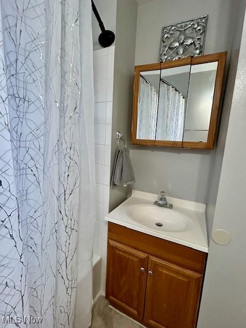 bathroom with vanity and shower / bath combo with shower curtain