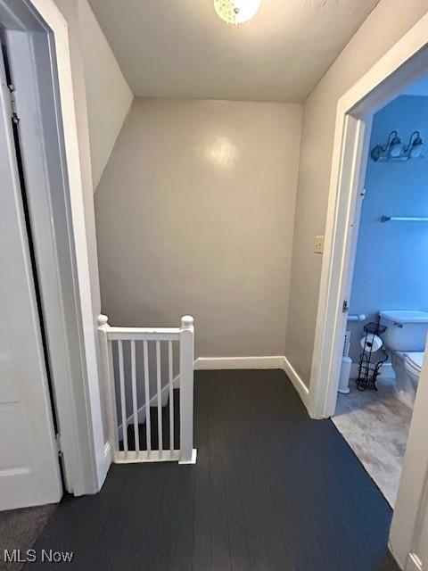 hallway with dark wood-type flooring