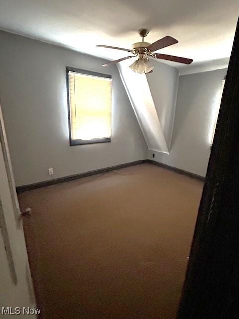 bonus room featuring ceiling fan, baseboards, and carpet flooring