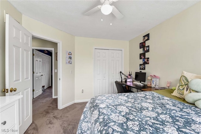 carpeted bedroom featuring ceiling fan and a closet