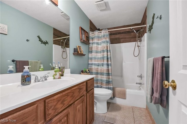 full bathroom with tile patterned flooring, vanity, toilet, a textured ceiling, and shower / bath combo with shower curtain