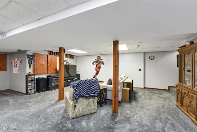 carpeted living room with a drop ceiling