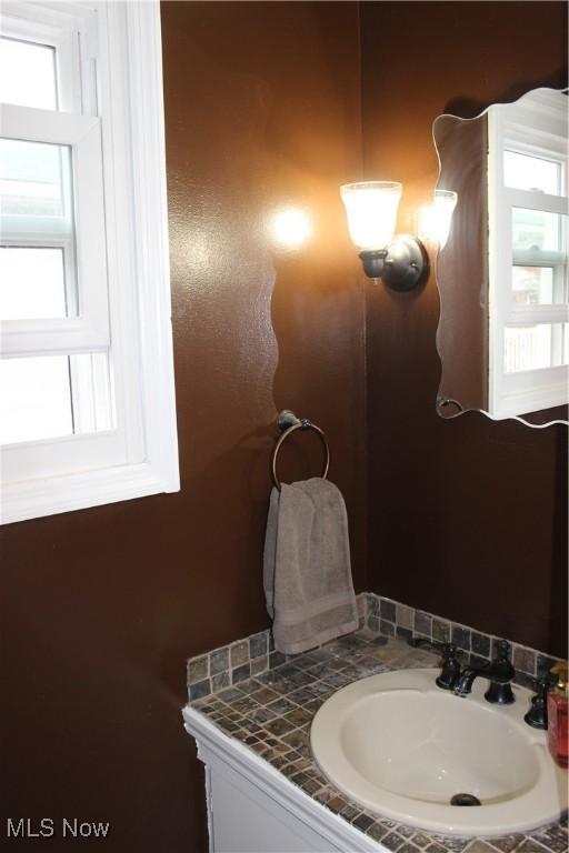 bathroom featuring vanity and a wealth of natural light