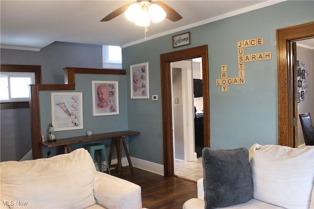 living room featuring ornamental molding, dark hardwood / wood-style floors, and ceiling fan