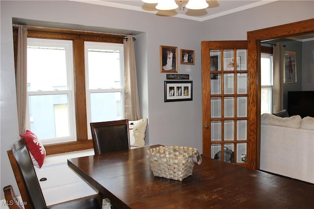 dining space with crown molding