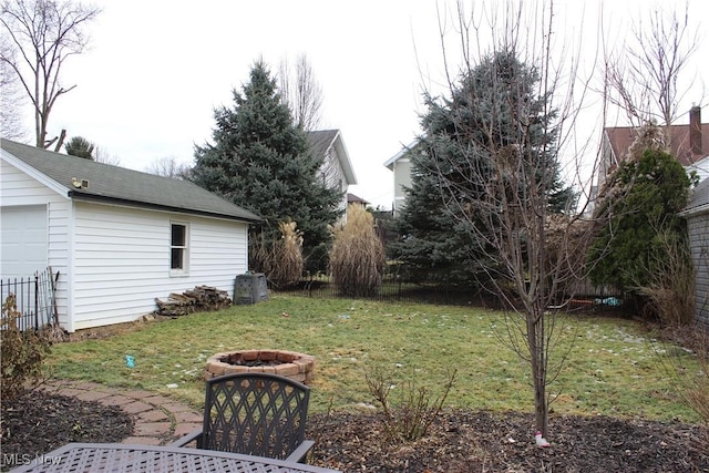 view of yard with a fire pit