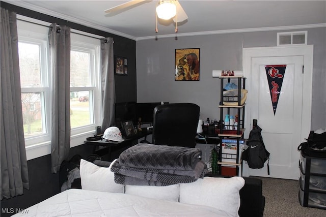 bedroom with multiple windows, crown molding, and ceiling fan