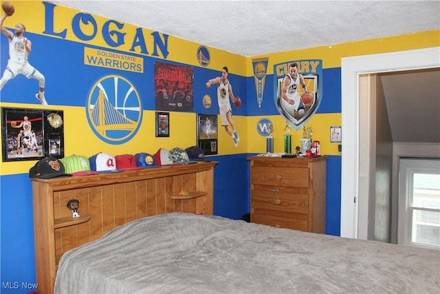 bedroom featuring a textured ceiling