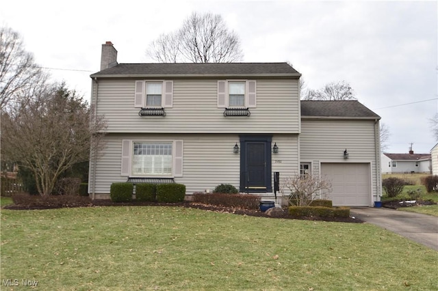 front of property featuring a garage and a front yard