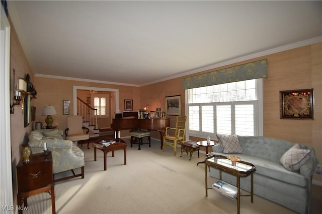 living room featuring crown molding and a healthy amount of sunlight