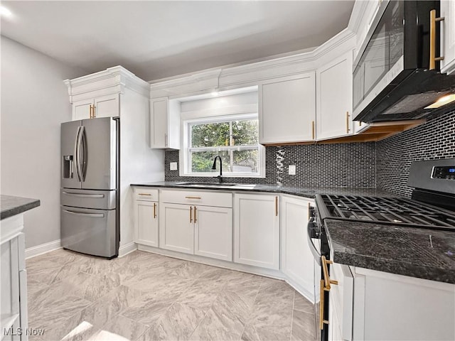 kitchen featuring white cabinetry, sink, backsplash, and stainless steel appliances