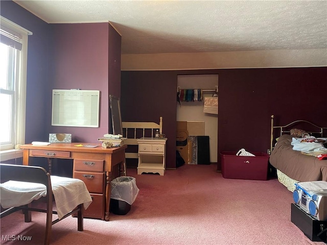 carpeted bedroom with a textured ceiling