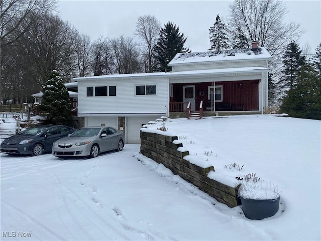 view of front facade featuring a garage and a porch