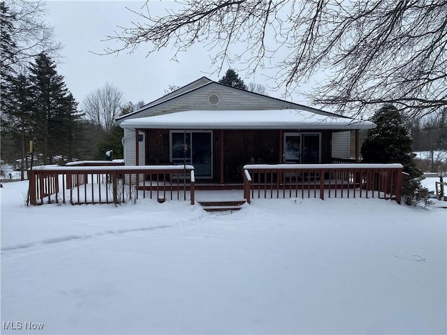 view of snow covered house