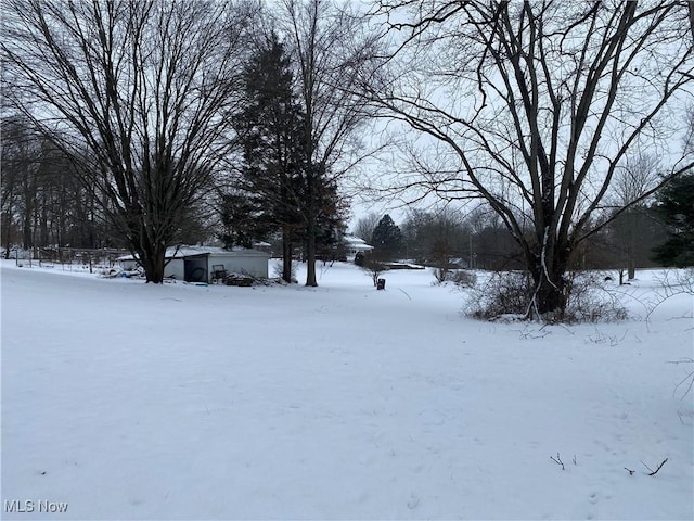 view of yard layered in snow