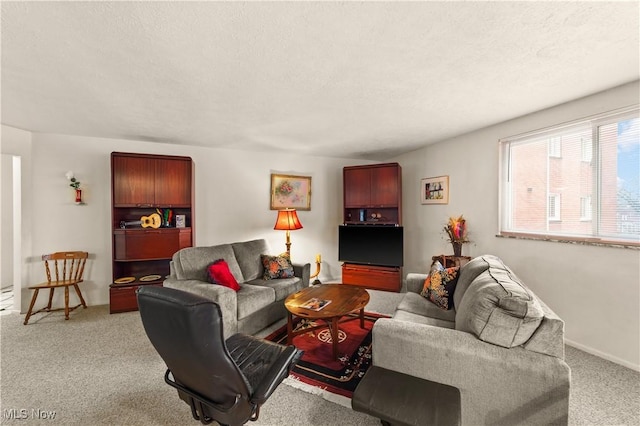 living room featuring light colored carpet and a textured ceiling