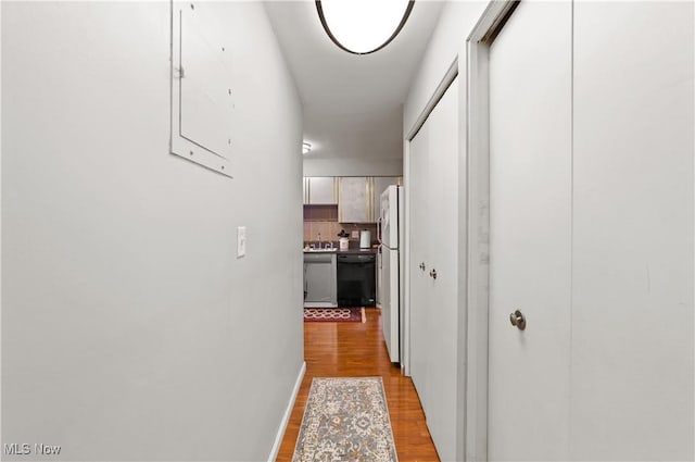 hall with light wood-type flooring