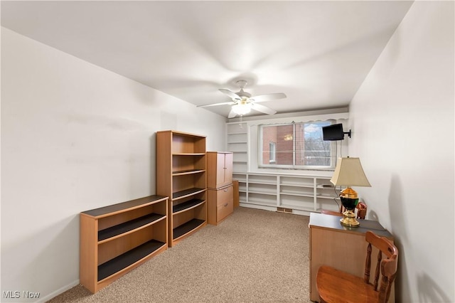 sitting room with carpet floors and ceiling fan