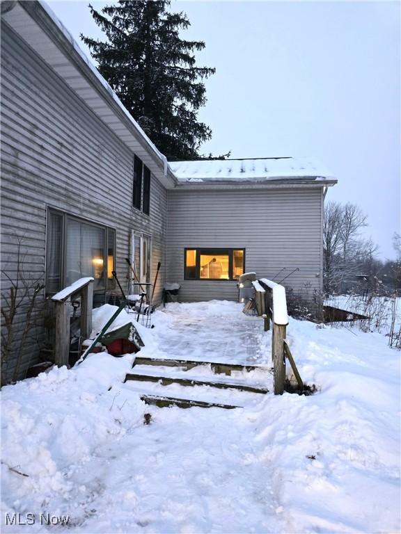 view of snow covered property