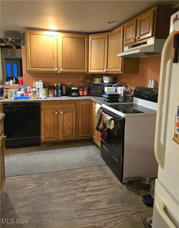 kitchen with under cabinet range hood and black appliances