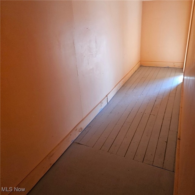 spare room with hardwood / wood-style floors