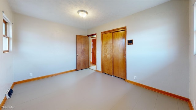 unfurnished bedroom featuring a closet