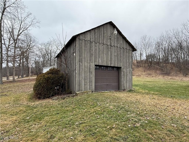 garage featuring a lawn