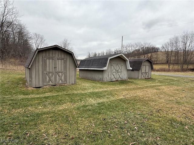 view of outdoor structure featuring a lawn