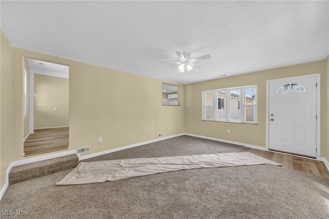 foyer entrance with hardwood / wood-style flooring and ceiling fan