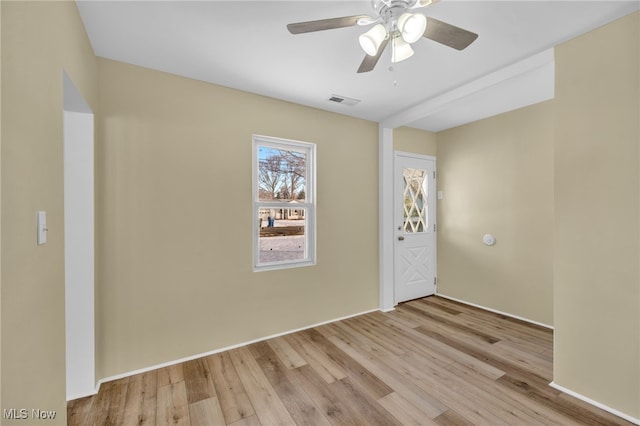 spare room with ceiling fan and light hardwood / wood-style flooring