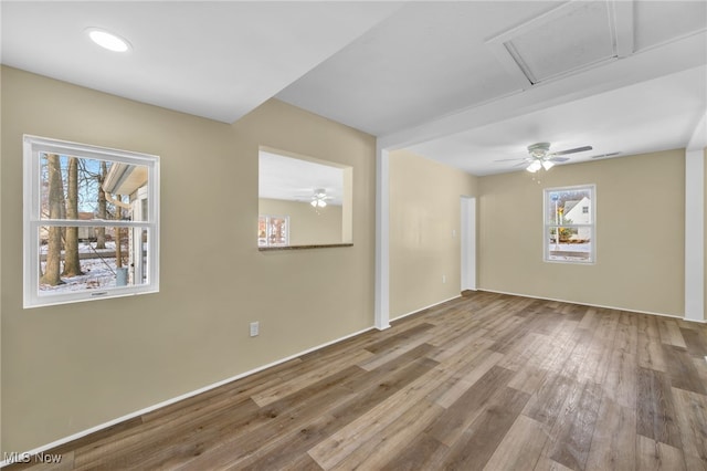 unfurnished room featuring hardwood / wood-style flooring and ceiling fan