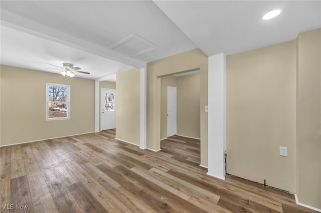 spare room featuring light hardwood / wood-style floors and ceiling fan